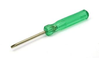 Green screwdriver on white photo