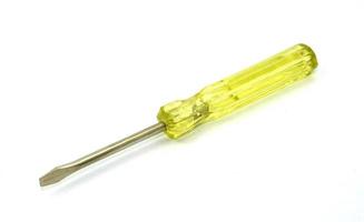 Yellow screwdriver on white photo