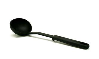 Plastic ladle on white photo