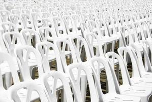 Rows of white chairs photo