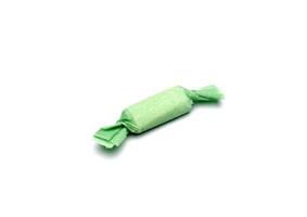 Green taffy candy on a white photo