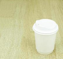 Paper cup on table photo