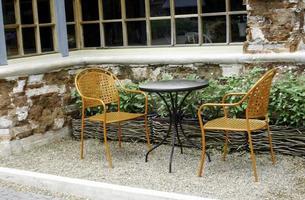 Two chairs and a table photo