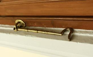 Brass window hook photo