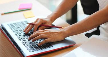 Person typing on a computer photo