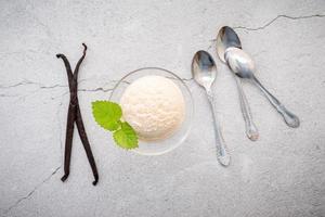 Vanilla ice cream with spoons and decorations photo