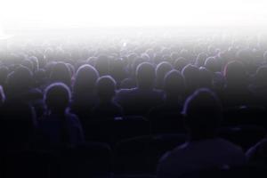 People sitting in a theater photo