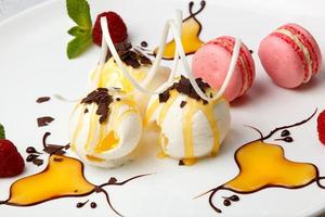 Pink macaroons with vanilla ice cream and honey photo