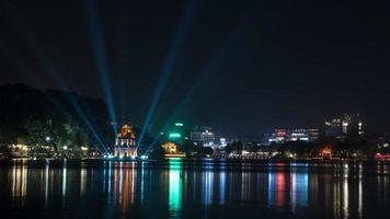 Hanoi, Vietnam, 2020 - Turtle Tower at Hoan Kiem Lake at night photo