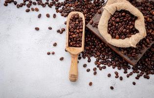 Roasted coffee beans with scoops photo