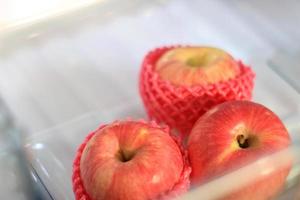 Fresh apples in refrigerator photo