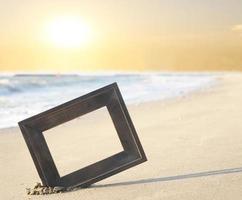 Picture frame in sand photo