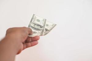 Man's hand with money isolated on a white background photo