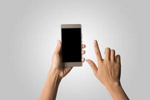 Hand holding a smartphone isolated on white background photo