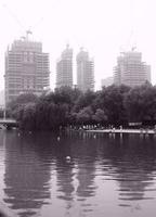 Buildings and people at a park in Shanghai photo