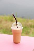 Coffee in a plastic cup photo