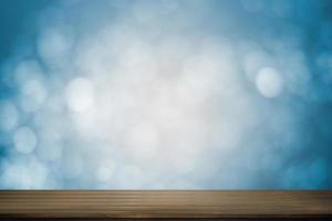 Wood table with soft blue bokeh background
