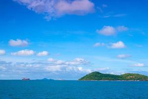 Cargo ship near the island photo