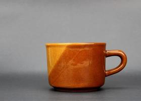 Brown mug on gray background photo