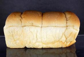 Bread loaf on black photo