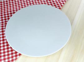 White plate on table photo
