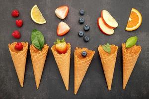 Various fruits in cones photo