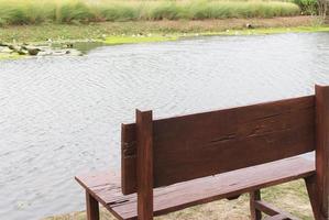 Bench by a pond photo