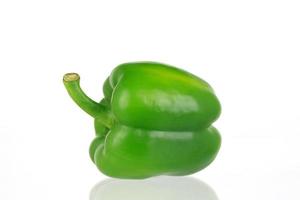 Green bell pepper on white background photo
