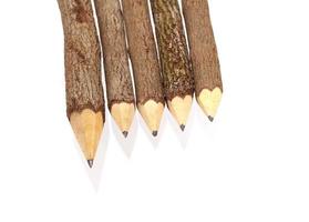 Wooden pencils on white photo