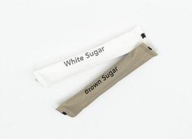 Sugar packets on white background photo