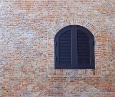 Old brick wall with window photo