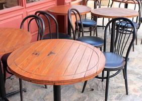 Wood tables and metal chairs photo