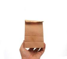 Person holding paper bag photo