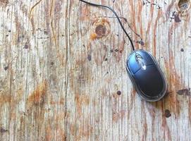 Computer mouse on wood table photo