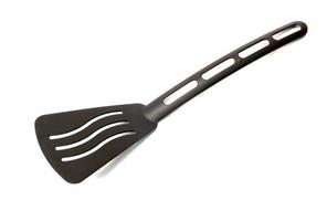 Black spatula on white photo