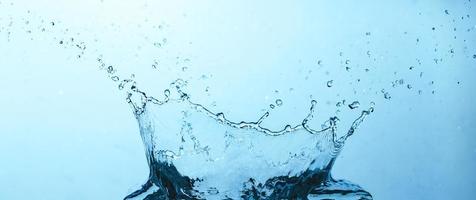Water splash on blue background photo