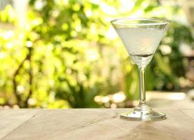 Martini glass on table photo