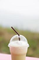 Coffee in a plastic cup photo