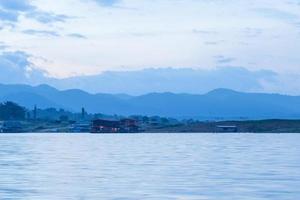 Houseboat on the river in Thailand photo