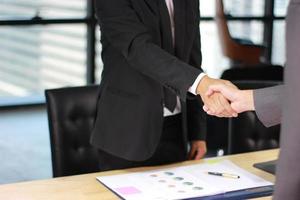 Businessmen shaking hands photo