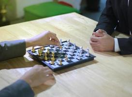 Two people playing chess photo