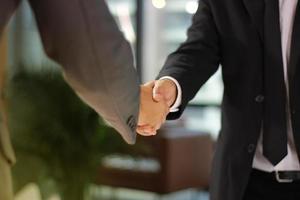 Two men shaking hands photo