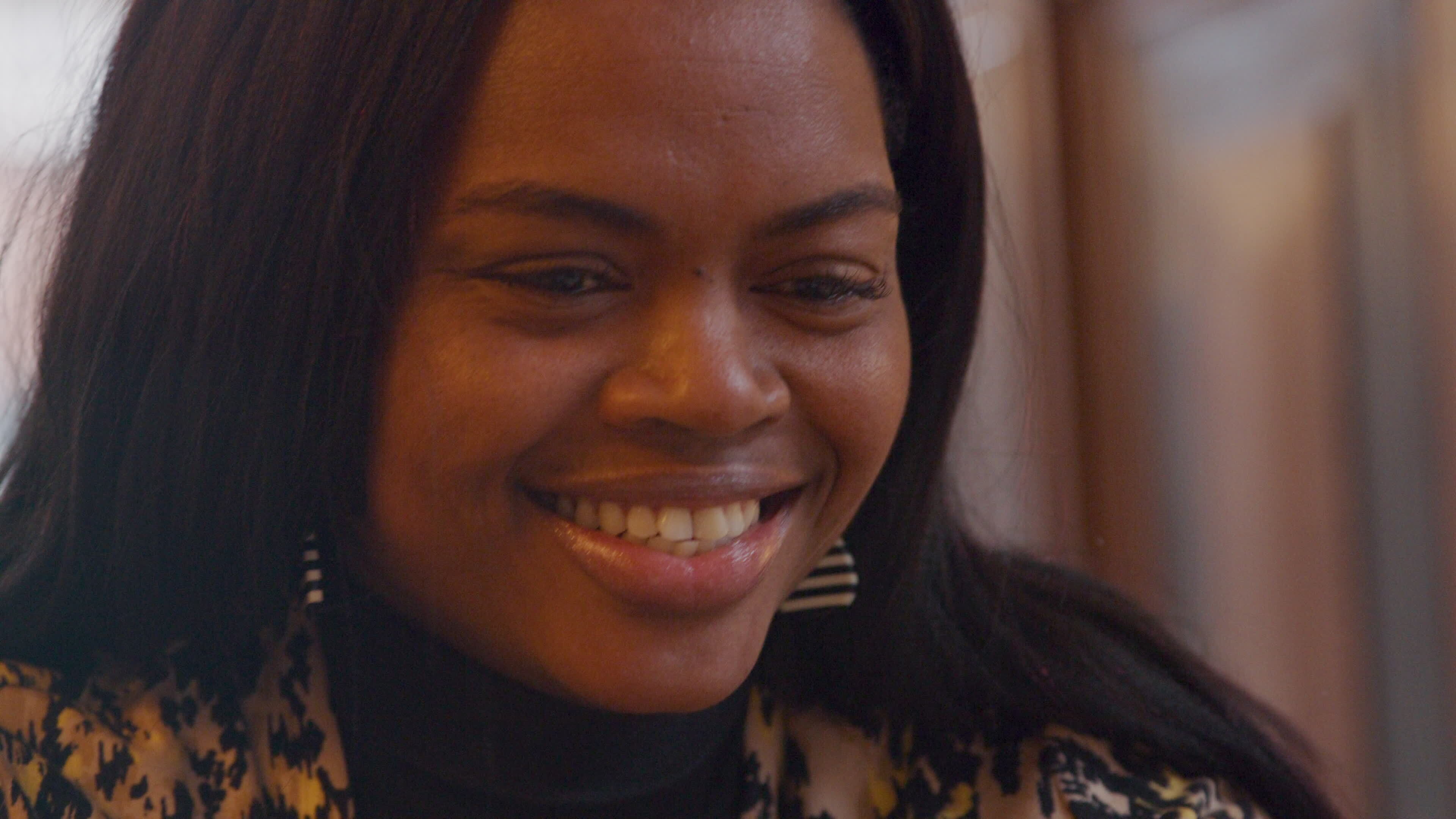 Close up of woman who talks vividly, frowns, laughs, turning her head ...