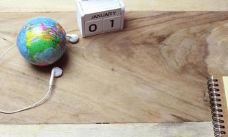 Wooden calendar on desk photo