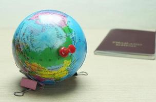 Globe with thumbtack on it photo