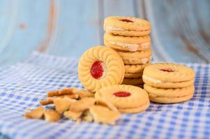 Sandwich cookies with strawberry cream photo