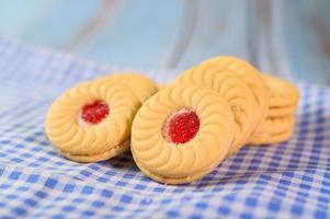 Sandwich cookies with strawberry cream photo