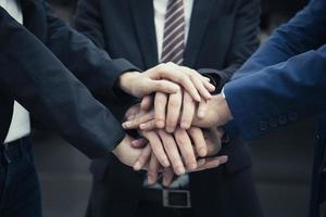 Group of business partners with hands together
