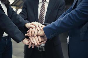 Group of business partners with hands together