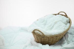 Handmade basket and white cloth photo